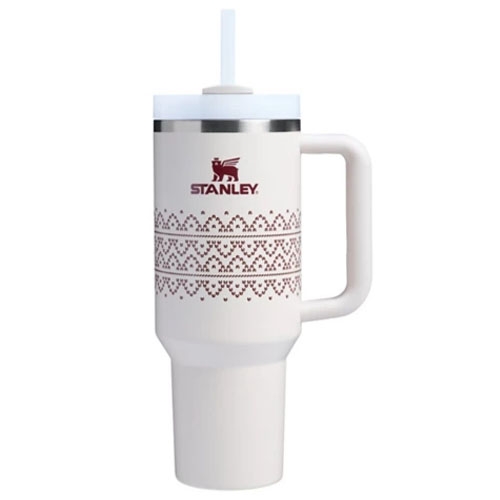 White 30oz Stanley Tumbler with handle and straw; features a maroon logo and decorative pattern around the center, and has a stainless steel rim below the lid.