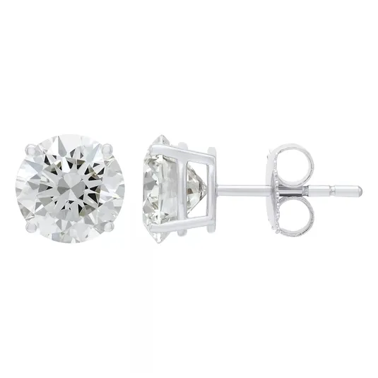 A pair of round-cut diamond stud earrings in a four-prong white metal setting with a push-back closure.