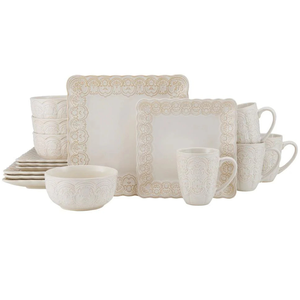 16-piece Pfaltzgraff dinnerware set featuring intricate lace-like patterns on square plates, bowls, and mugs, all in a soft cream color.