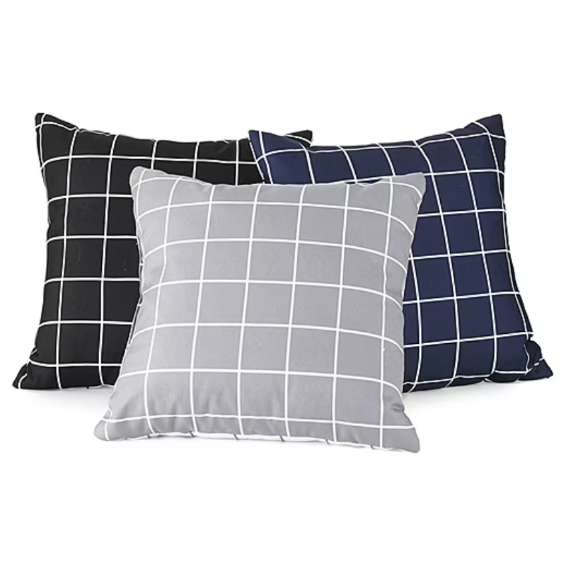 Three square throw pillows with a grid pattern, featuring colors of black, gray, and navy blue.