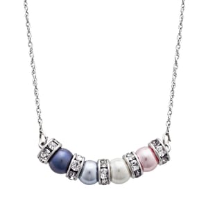 A necklace with a silver chain features five pearls in blue, light blue, white, and pink hues, each separated by sparkling rhinestone spacers.