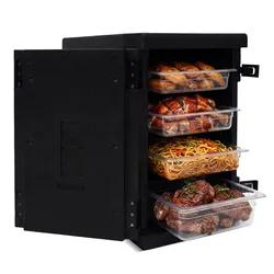 A black insulated food storage container holds multiple trays of various cooked dishes, including roasted meats and noodles.