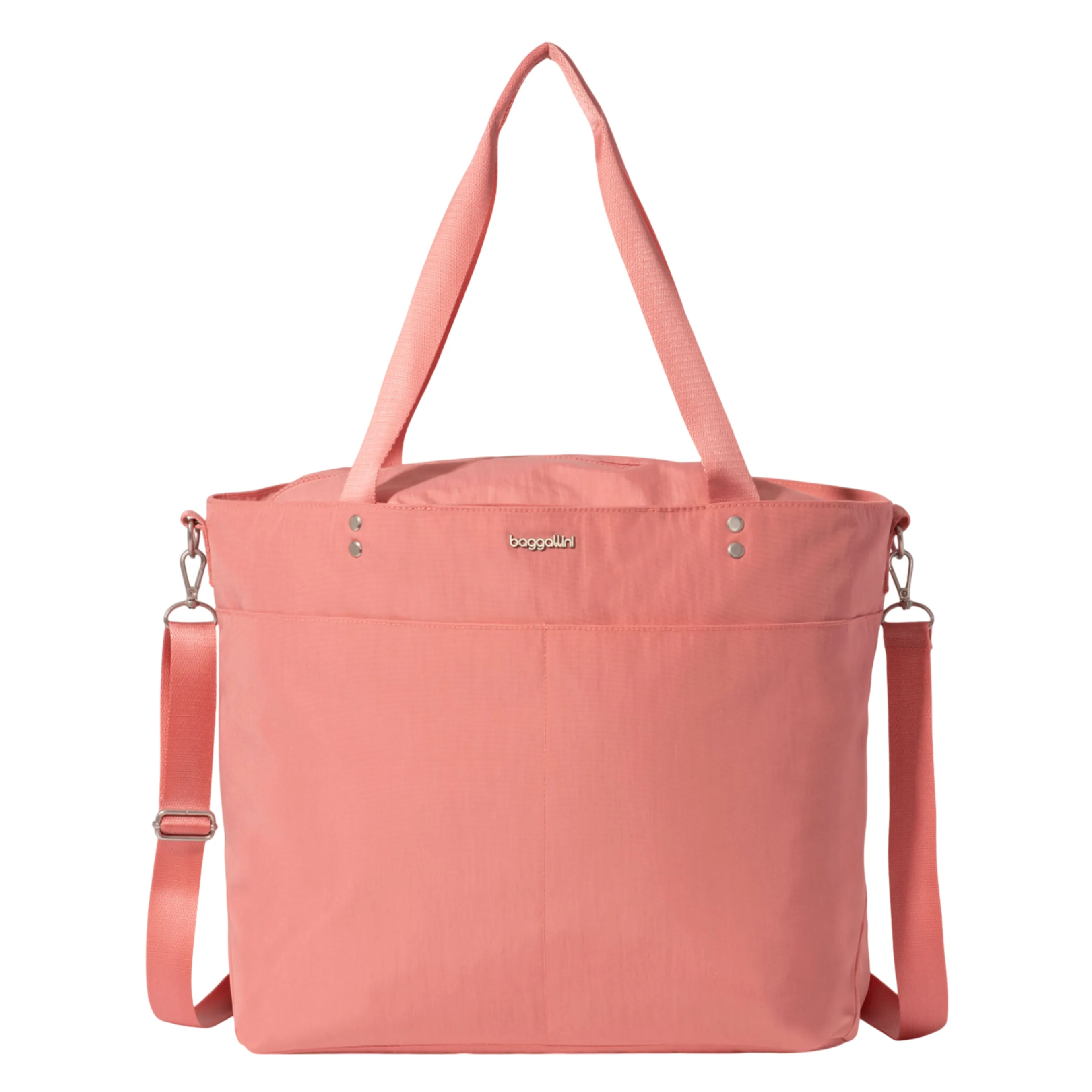 A coral-colored tote bag with dual handles and an adjustable shoulder strap, featuring a metal logo and silver-tone hardware accents.