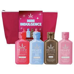 Hempz Mini Indulgence set includes four 2.25 fl oz bottles: Brazilian Berry body moisturizer, Ocean Breeze body wash, Vanilla Lux moisturizer, and Sweet Jasmine & Rose moisturizer, packaged in a pink zip pouch.
