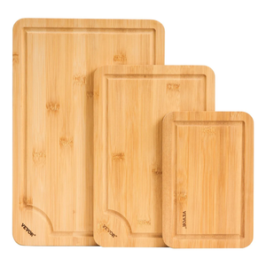 Set of three bamboo cutting boards with grooved edges, each varying in size.
