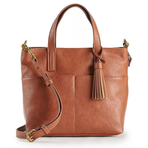 Tan leather mini handbag with dual short handles and a detachable shoulder strap, featuring a tassel accent and front pocket detailing.