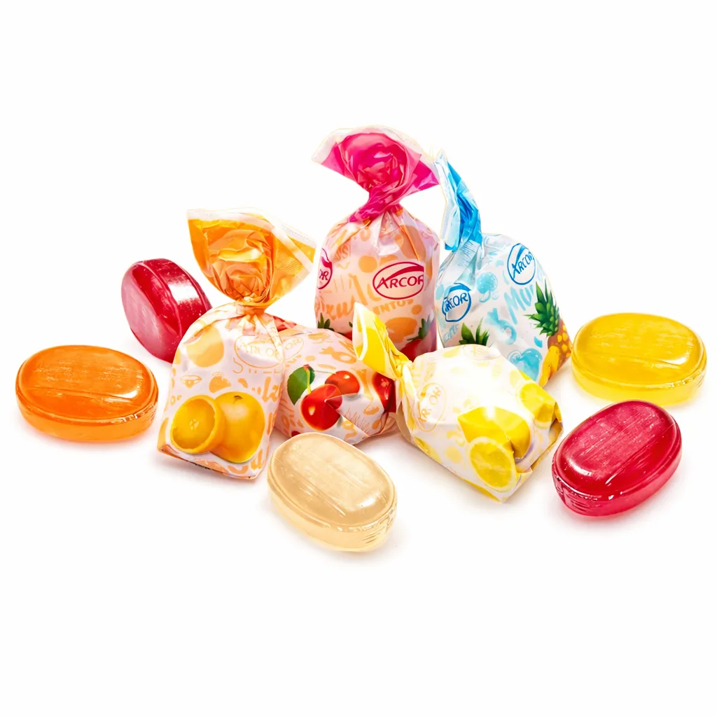 Individually wrapped fruit-flavored hard candies, featuring flavors like cherry, lemon, and orange, with translucent colors matching the fruit illustrations on the packaging.