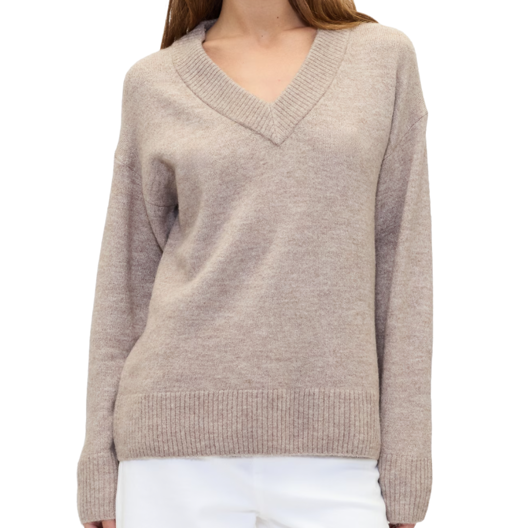 A beige V-neck sweater with ribbed cuffs and hem, paired with white trousers.
