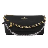 A black Kate Spade New York handbag featuring gold and silver chain straps, a gold spade charm, and a small black bow detail.