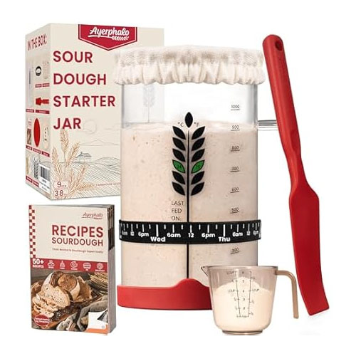 Sourdough Starter Kit includes a glass jar with measurements, a red spatula, a measuring cup, a fabric jar cover, a recipe book for sourdough, and instructions for feeding.
