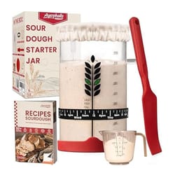 Sourdough Starter Kit includes a glass jar with measurements, a red spatula, a measuring cup, a fabric jar cover, a recipe book for sourdough, and instructions for feeding.