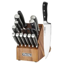 A wooden knife block set with multiple stainless steel knives and a pair of kitchen shears. The block has \“Viking\“ branding.