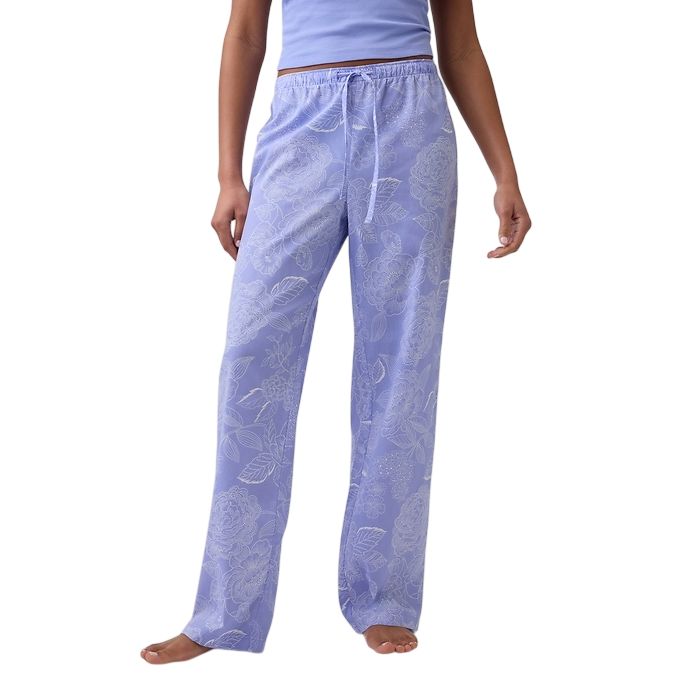 Light purple pajama pants with an elastic waistband, drawstring, and floral pattern. Worn with a matching tank top.