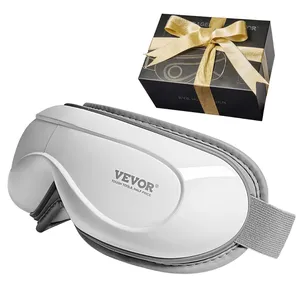 A Vevor eye massager with an elastic strap is displayed alongside a black gift box tied with a gold ribbon.