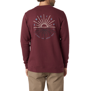 A burgundy O'Neill sweatshirt featuring a graphic on the back with a sun and mountain design, along with the text \“First In Last Out\“ and \“1952\“. Paired with beige pants.