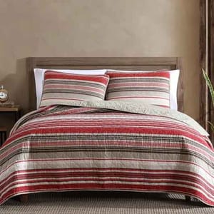 The Eddie Bauer Cotton Queen Quilt Set features a rustic design with red, green, and beige horizontal stripes. It includes a quilt and matching pillow shams, creating a cozy and classic look for the bedroom.