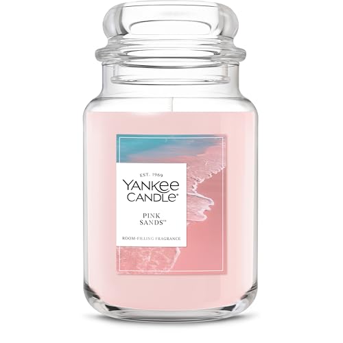 Yankee Candle in the Pink Sands scent, featuring a pink color and room-filling fragrance, with a coastal-themed label.
