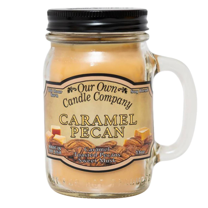 Caramel Pecan 13oz. Mason Jar Candle from Our Own Candle Company features a soy blend with scents of caramel, toasted pecans, and sweet musk. Made in the USA, it promises a 100-hour burn time.