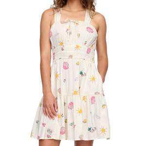 A white dress with a sleeveless design and colorful beach-themed prints, including shells, sun, and sea creatures. The dress features shirred detailing at the bodice and a tiered skirt.