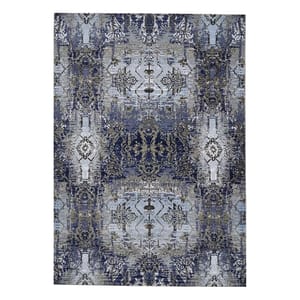 A 5'2\“ x 7'2\“ area rug featuring a symmetrical pattern with floral and geometric designs in shades of blue and grey.