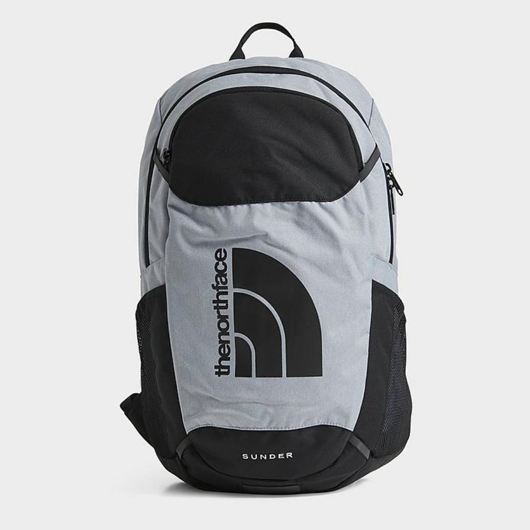 A gray and black backpack with reflective elements and a prominent logo design.