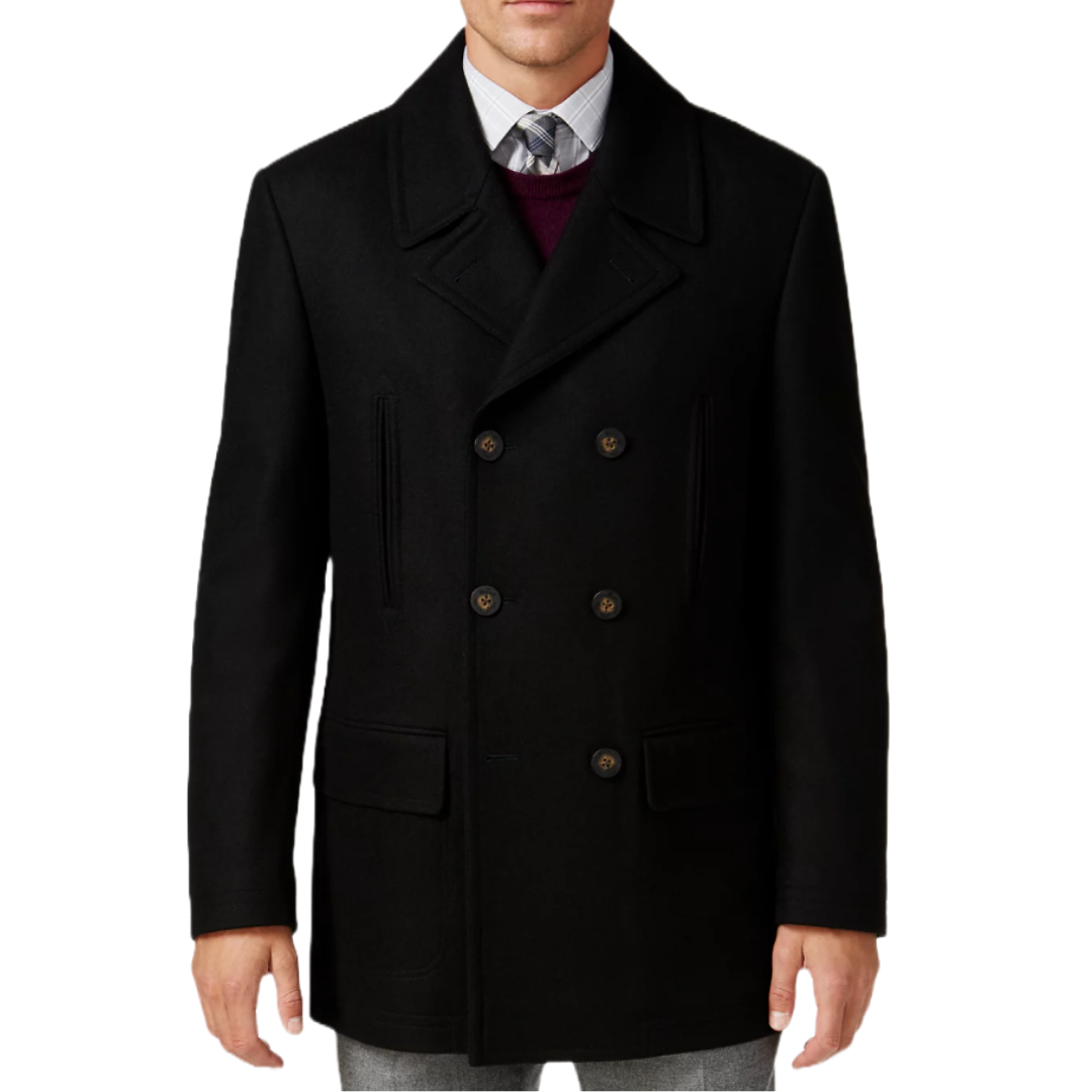 A man is wearing a black, double-breasted peacoat with wide lapels and slanted pockets. The coat is paired with a dress shirt, tie, and sweater.