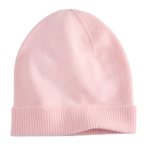 A light pink knit beanie with a folded brim.