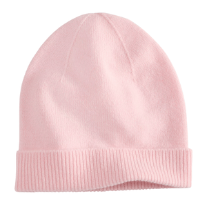 A light pink knit beanie with a folded brim.