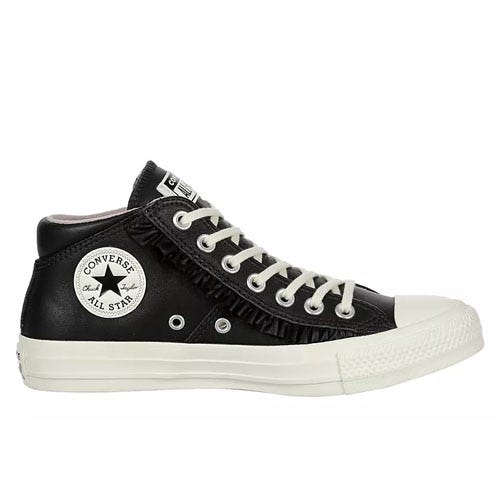 Black Converse Chuck Taylor Mid Top Sneakers with white laces, featuring a white rubber sole and the classic All Star logo on the side, along with decorative fringe detailing along the laces.