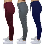 Three pairs of jogger pants in burgundy, gray, and navy, each worn with white sneakers.