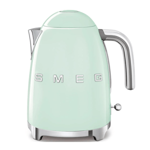 A light green SMEG electric kettle featuring a retro design with a chrome handle and spout, and the brand name prominently displayed on the side.