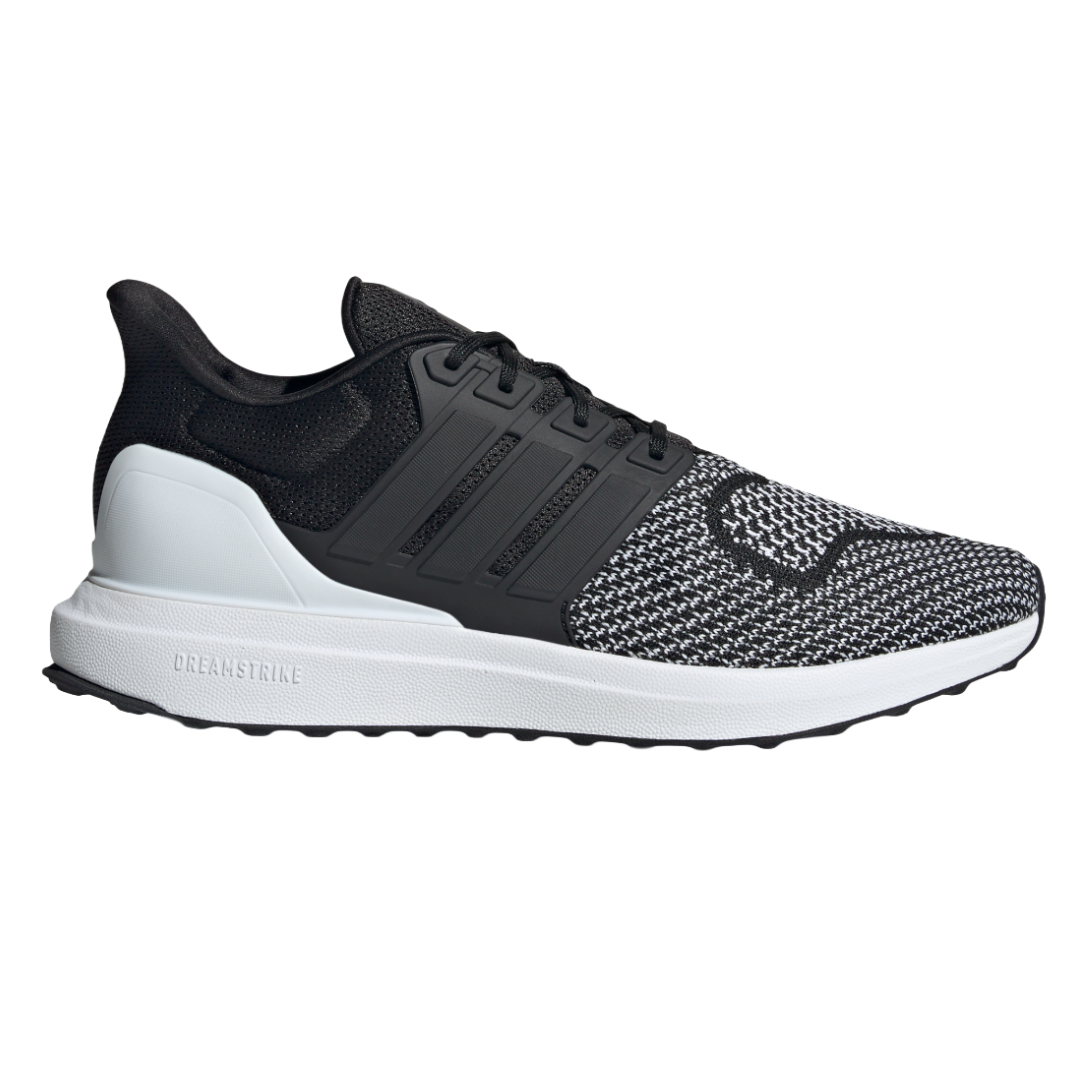 A black and white Adidas running shoe with a knit upper, black stripes, and a white sole featuring \“DREAMSTRIKE\“ branding.