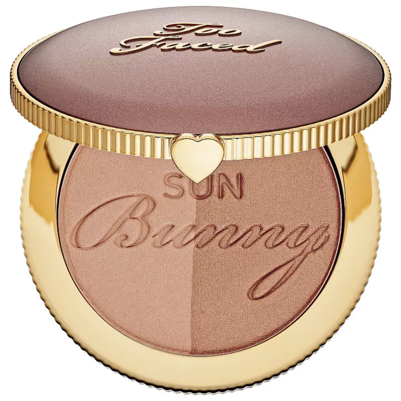 Too Faced Sun Bunny Natural Bronzer is a dual-shade bronzer in a round, gold-toned compact with the brand's logo on top and a heart detail. The bronzer features a shimmer finish for a sun-kissed glow.