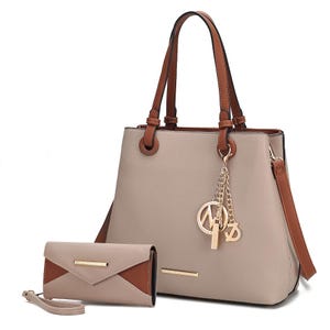 A beige and brown handbag with double handles and a detachable strap, accompanied by a matching beige wallet. Both feature gold accents and a decorative charm on the bag.