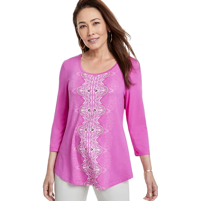 A pink JM Collection plus-size top features a scoop neck, 3/4 sleeves, and a symmetrical lace-like print running down the front.