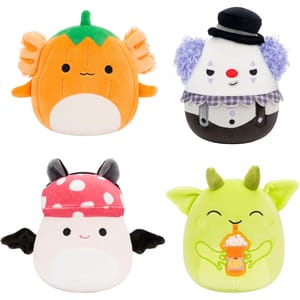 Four plush toys: an orange fish with a green leaf top, a white clown with a black hat and purple hair, a pink bat with a spotted hat, and a green creature with horns sipping a drink.