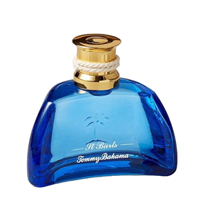 Tommy Bahama St. Barts Cologne features a blue, rounded glass bottle with a gold cap wrapped in white rope accents, bearing the Tommy Bahama logo and \“St Barts\“ inscribed.