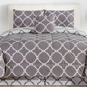 A gray and white comforter set featuring a geometric lattice pattern, including a comforter, two pillow shams, and a decorative pillow.