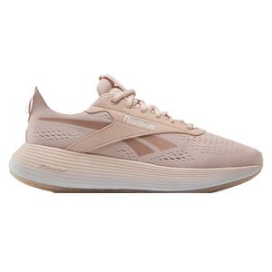 A single Reebok sneaker in a pale pink shade with mesh details and DMX cushioning.