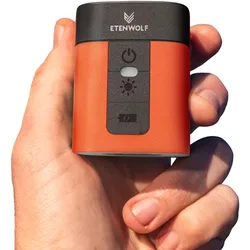 A compact orange and black device, branded \“ETENWOLF,\“ is shown held in a hand. It features a power button, a light indicator, and a lightning bolt symbol on its front panel.