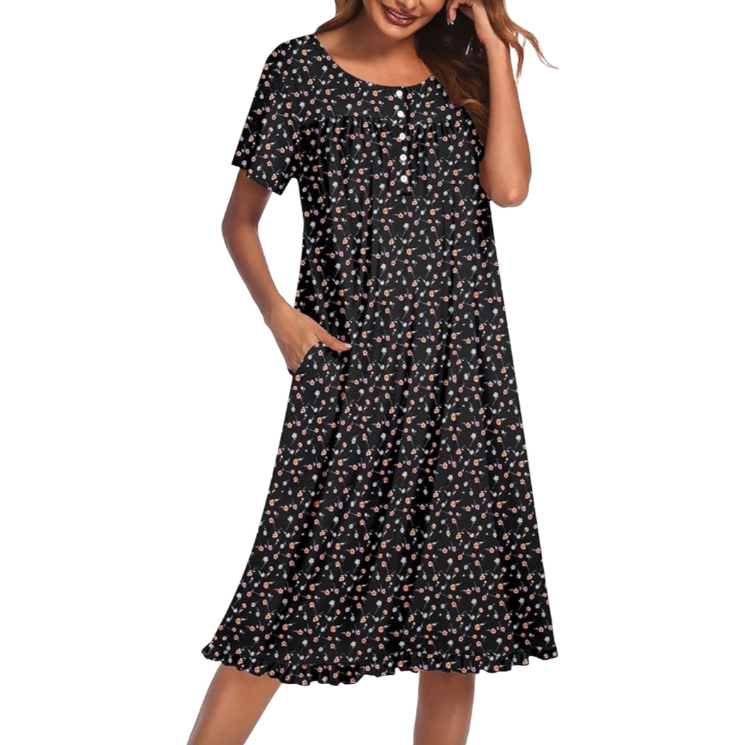 A knee-length black dress with a small floral pattern, featuring short sleeves and side pockets.