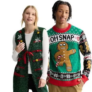 A woman wears a green, holiday-themed vest with red ribbon and pom-pom accents, and a man wears a festive green sweater with an \“Oh Snap\“ gingerbread man design holding a candy cane.