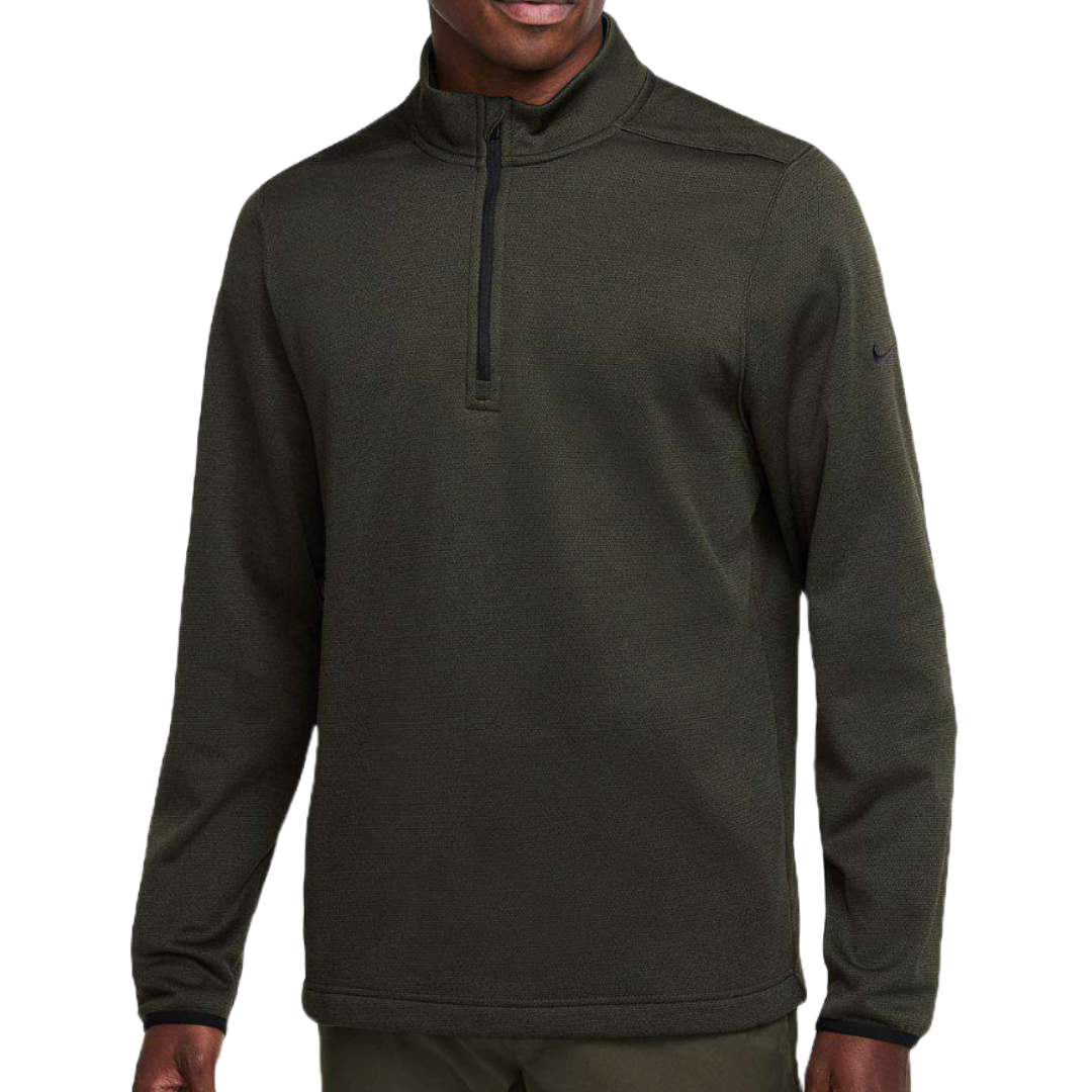 Nike Therma-FIT Quarter-Zip Pullover in dark green features a quarter-zip design, long sleeves, and a subtle Nike logo on the sleeve.