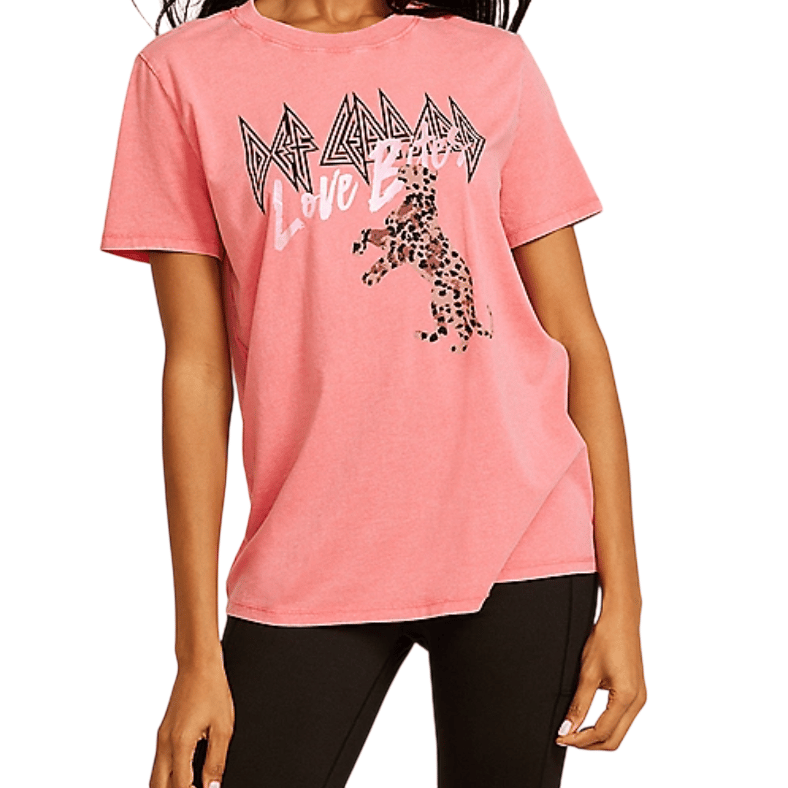 Pink T-shirt featuring \“Def Leppard Love Bites\“ text and a leopard graphic, paired with black leggings.