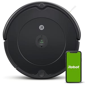 A black, round iRobot Roomba 694 robotic vacuum is shown alongside a smartphone displaying the iRobot logo. It features a central \“Clean\“ button and Wi-Fi connectivity for smart cleaning control.