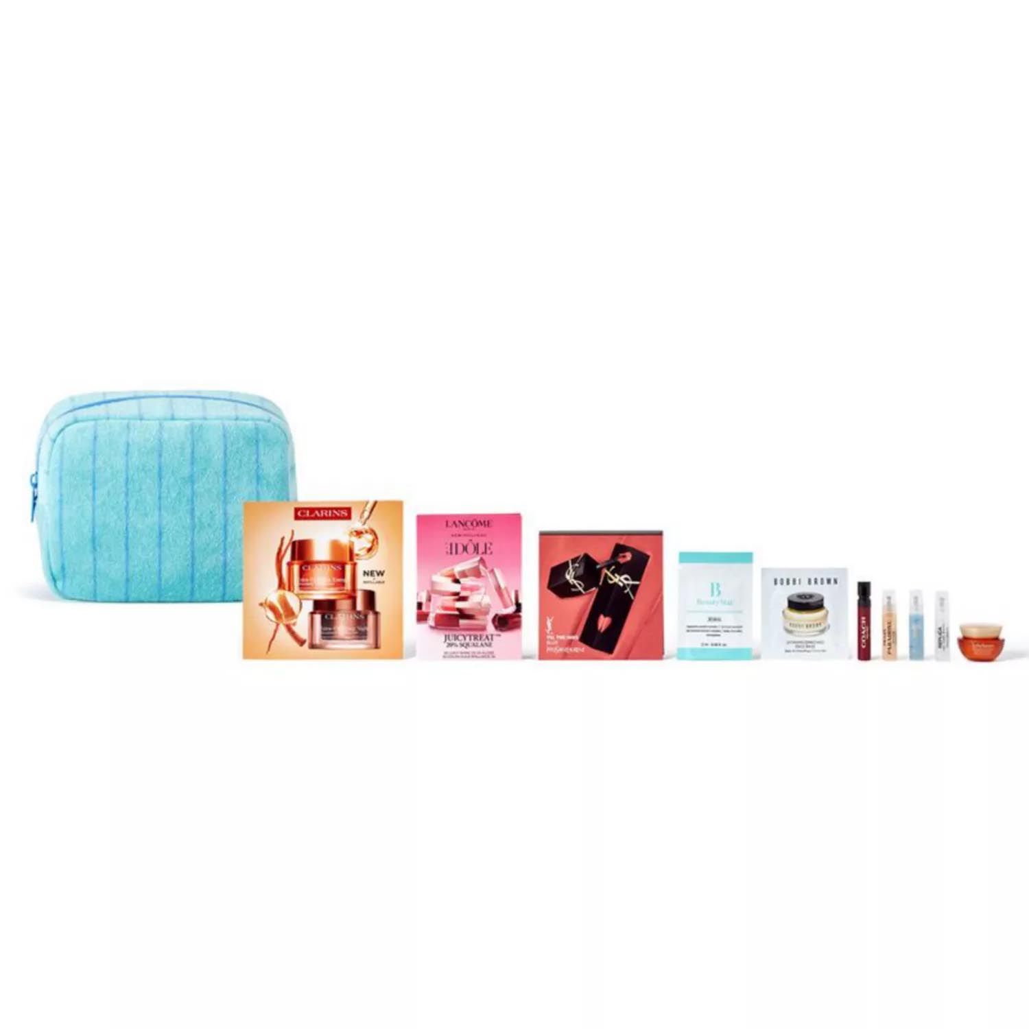 A blue makeup bag with assorted beauty samples, including Clarins, Lancôme, YSL, Bobbi Brown, and other skincare and fragrance items.