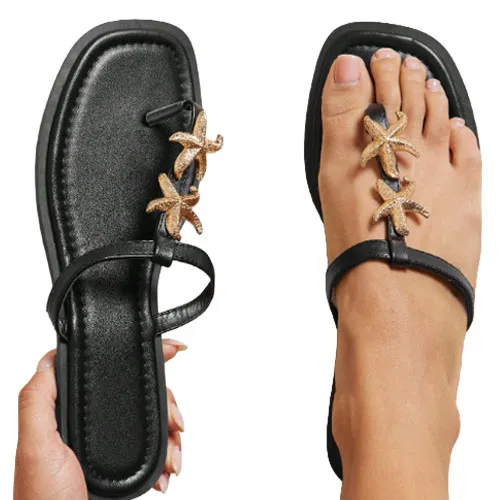 Black sandal with a square toe design, featuring decorative gold starfish accents on the straps.