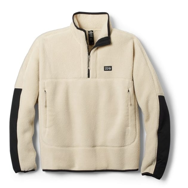 Beige fleece pullover with a quarter-zip front, black panels on the undersides of the sleeves, and a chest pocket, featuring a small square logo on the front.