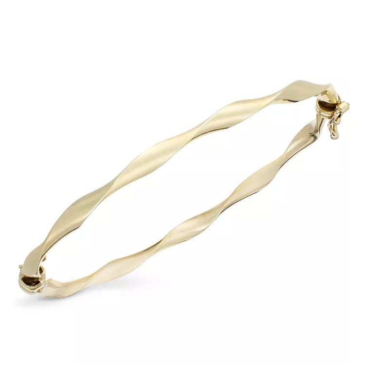A sleek 10k gold twist bangle bracelet featuring a wavy design, equipped with a hinged closure for secure wear.