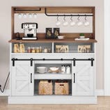 A kitchen shelf features a coffee station with a coffee maker, hanging mugs, jars, and various packaged items. Below are shelves with dishes, baskets, and sliding barn-style cabinet doors.